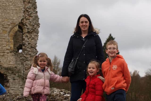 Mansfield mum Vivienne Davidson with son Daniel 8 and twins Holly and Hanna, 4 who will have to attend different schools because of a changed admission policy.