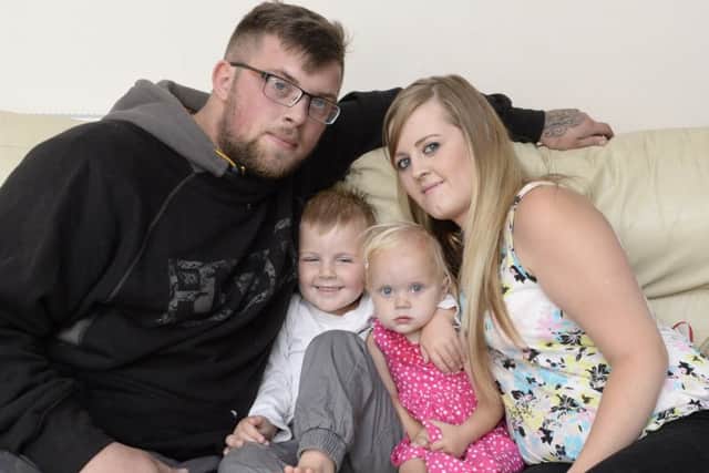 The Huthwaite family are waiting for doctors to reveal the one-year-old's prognosis after major heart surgery earlier this year. Pictured with dad Arran Waudby, brother Riley and mum Kerry Clinton.