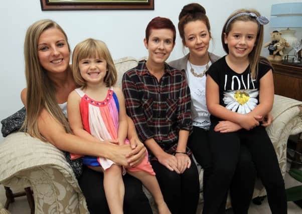 Liz Sheppard from Mansfield Woodhouse has just a year to live and is calling for information about her cancer becuase doctors are baffled by it. Liz is pictured with two of her children Olivia and Grace and her cousins Jessica Grieves and Fran Grieves.