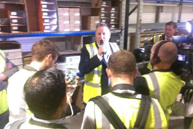 Sports Direct's Mike Ashley talks to the press inside one of his Shirebrook warehouses.