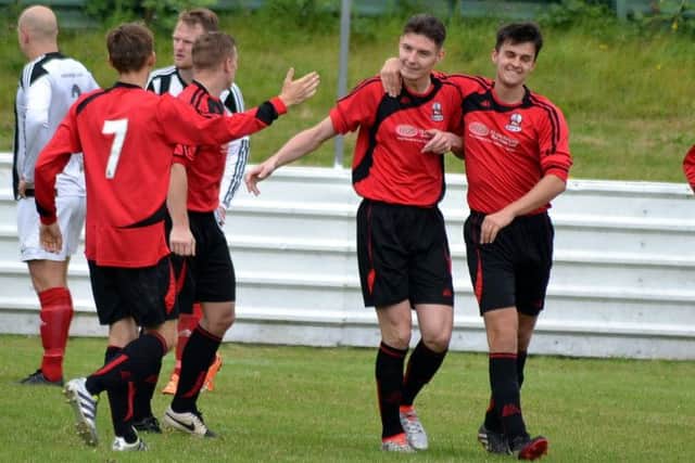 Shirebrook celebrate a goal against Westella. All photos by Peter Waby.