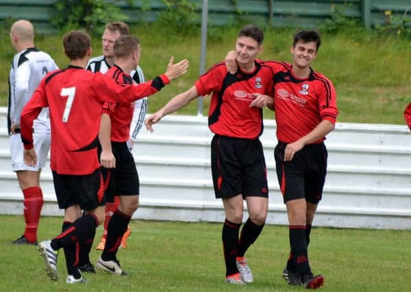 Shirebrook celebrate a goal against Westella. All photos by Peter Waby.