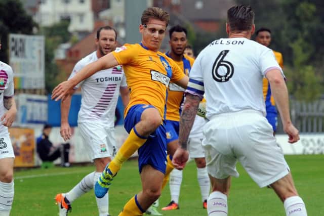 Mansfield Town v Barnet.Danny Rose launches into a masked crusade against the Barnet defense.