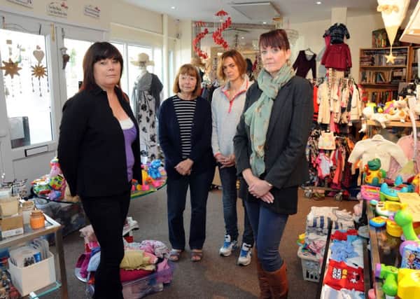 Volunteers at the  Donate and Dazzle charity shop in Huthwaite are disheartened after thieves broke into their Main Street shop, stealing goods and causing damage to the tune of Â£2,500.  Pictured from left, are Michelle Willows, Doreen Papworth, Paula Tempest and manager Amanda Langton.