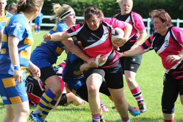 GREEN FOR GO! -- prop Tina Green powering through Old Leamingtonians defence during Ashfield Ladies first match of the new league season.