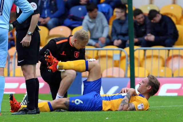 Mansfield Town v Barnet
English League Football - Sky BET League Two
Field Mill, Mansfield, England
10th September 2016
Mansfield Town's George Taft gets treatment before leaving the pitch injured
Picture by Dan Westwell
dan.westwell@btinternet.com
07793 733140