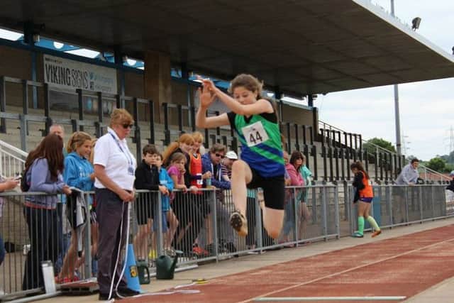 JUMPING TO IT -- Mansfield Harriers long-jumper Bryony Evans, who competed for the county for the first time.