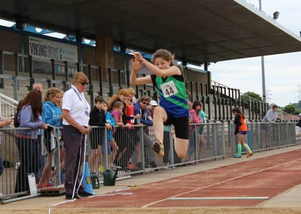 JUMPING TO IT -- Mansfield Harriers long-jumper Bryony Evans, who competed for the county for the first time.