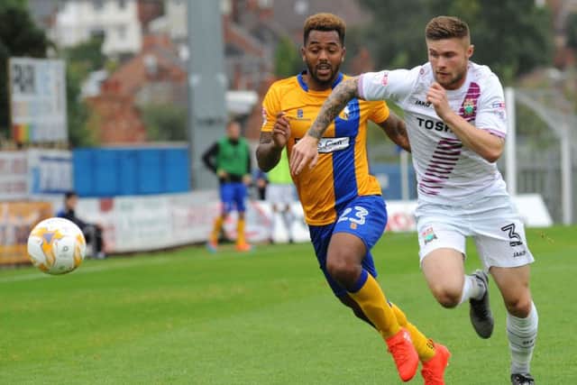 Mansfield Town v Barnet.Ashley Hemmings and Elliott Johnson chase down a first half ball.