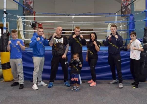 Kegg Capeness, founder of Bulwell Fight Factory, with fighters and family members.