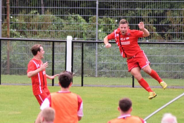 Gary Bradshaw (right) celebrates scoring the winner at Coalville,. Photo by Peter Craggs.