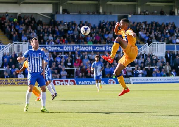 Mansfield Town's CJ Hamilton controls the ball - Pic by Chris Holloway