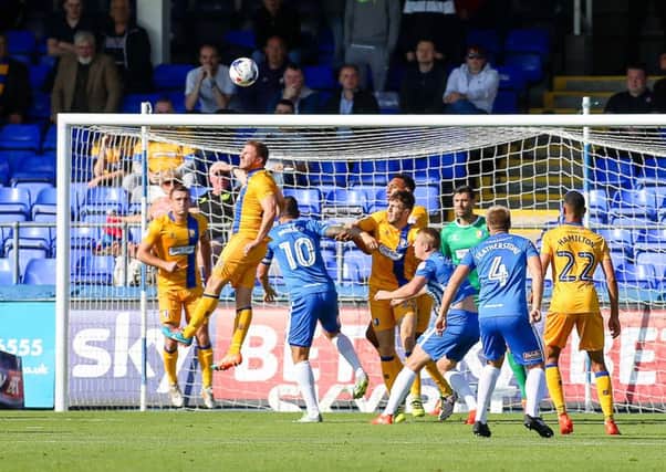 Mansfield Town's JamieMcGuire clears the danger  - Pic by Chris Holloway