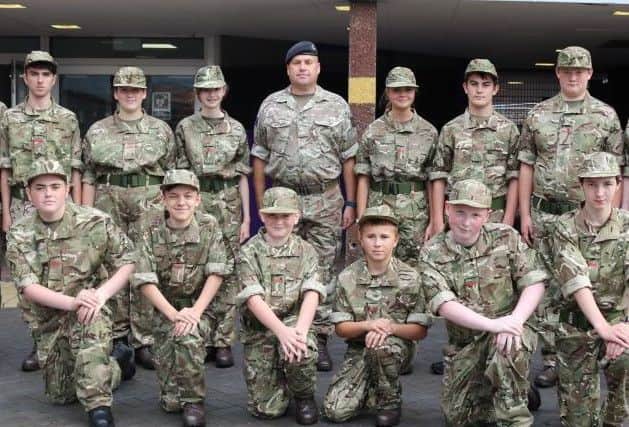 Cadets and adult volunteers outside Sutton Academy.