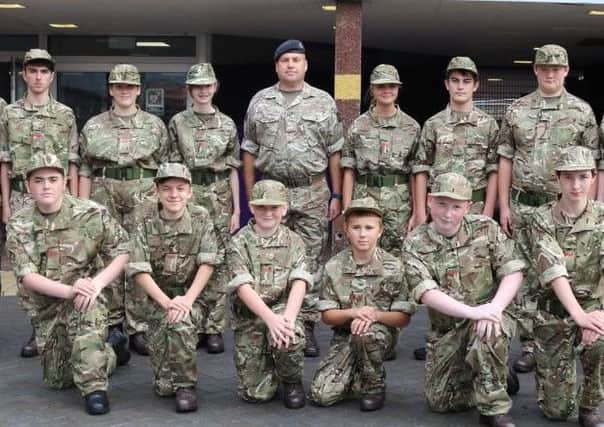 Cadets and adult volunteers outside Sutton Academy.