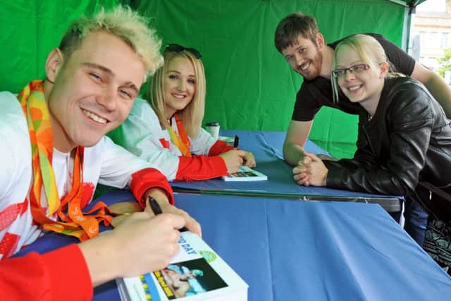 Mansfield Market Rio Day.Paralympians, Ollie Hynd and Charlotte Henshaw sign autographs for Chris Foreman and Sarah Williams.