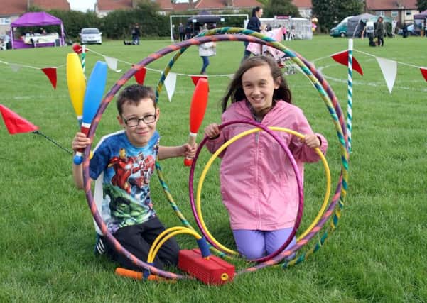 Travis Wilson and sister Kacie were brushing up on their circus skills.
