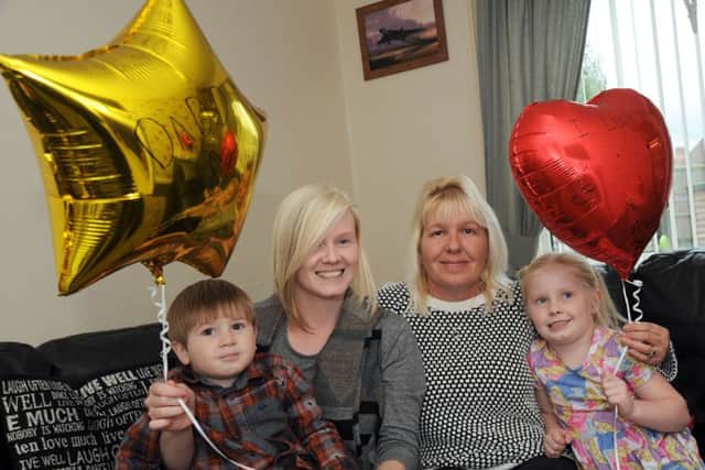 Helen Darby with her chidren Enya and Wesley, and Nathan's mum Shirley, who released balloons with messages of love for their dad.
