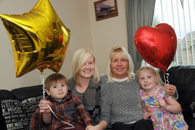 Helen Darby with her chidren Enya and Wesley, and Nathan's mum Shirley, who released balloons with messages of love for their dad.