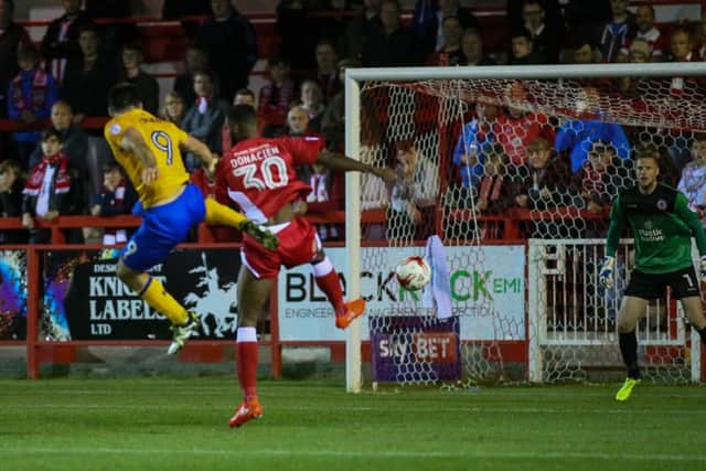 Mansfield Town's Patt Hoban heads for goal - Pic by Chris Holloway