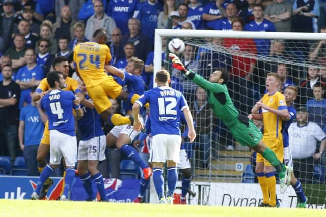 Tommy Lee stretches as he tries to stop Calvin Andrew's headed goal by Tina Jenner Chesterfield  v Mansfield Town