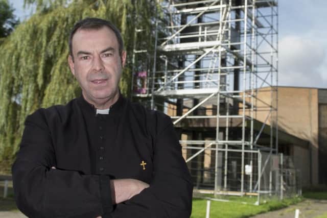 Father Nicolas Spicer outside St PaulÃ¢Â¬"s Church, Pelham Street, Worksop. Scaffolding on the bell tower is proving expensive as they try to tackle the pigeon problem. Picture: Sarah Washbourn