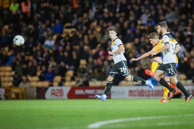 Mansfield Town's Tom Marriott shoots - Pic Chris Holloway
