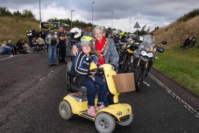Jess Simpkin, pictured wit Mansfield mayor Kate Allsop at a charity world record event for the highest number of triumphs in convoy. (Photo Neil Pledger)