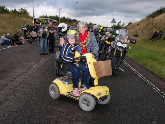 Jess Simpkin, pictured wit Mansfield mayor Kate Allsop at a charity world record event for the highest number of triumphs in convoy. (Photo Neil Pledger)
