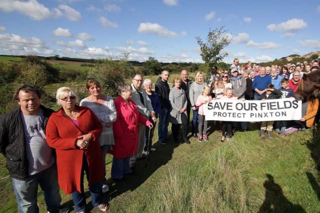 Protesters gather on the greenfields behind Talbot Street which is narrow and busy and where developers want to build 250 houses, United Kingdom on 2 October 2016. Photo by Glenn Ashley.