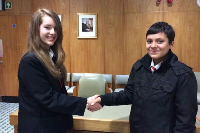 Anna Rigby has been elected as Mansfield's new Youth Mayor. Pictured shaking hands with runner up  Khaleel Zareen.