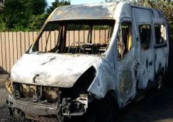 The 'Our Centre' bus was twice set alight by arsonists.