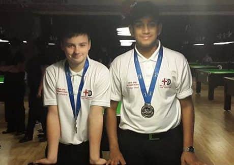 WORLD CHAMPION -- Mansfield pool player Jacob Elmhirst (left), pictured with his doubles partner Krish Patel, who helped England U15s to the world team title.
