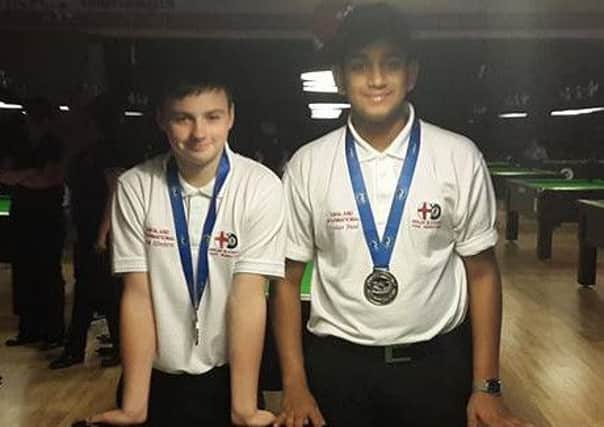 WORLD CHAMPION -- Mansfield pool player Jacob Elmhirst (left), pictured with his doubles partner Krish Patel, who helped England U15s to the world team title.