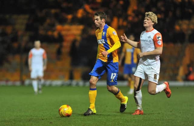 Mansfield in action against Luton last season as Matty Blair gets away from Luton's Cameron McGeehan.
