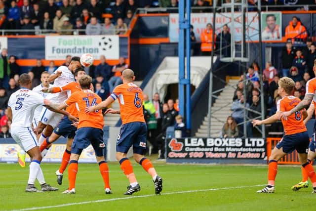 Mansfield Town's Rhys Bennett heads for goal - Pic by Chris Holloway