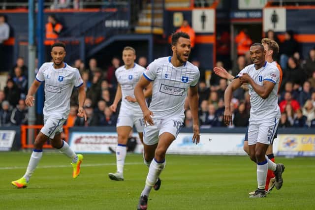 Mansfield Town's Matt Green turns to face the travelling fans after opening the scoring against Luton Town - Pic by Chris Holloway