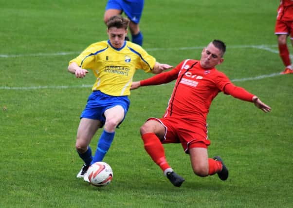 ACTION from AFC Mansfields 1-0 defeat at Garforth Town, which halted their run of improved form.
