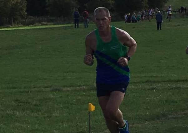 COUNTY CHAMPION -- Alan Kemp, who smashed his previous best time.