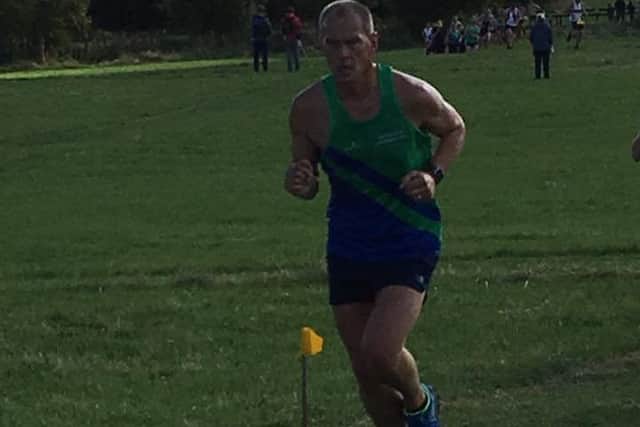 COUNTY CHAMPION -- Alan Kemp, who smashed his previous best time.
