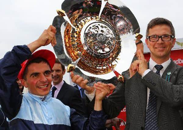 POST MASTER -- Andrea Atzeni, pictured with trainer Roger Varian at Doncaster, where the jockey has now won the last four renewals of the Racing Post Trophy.