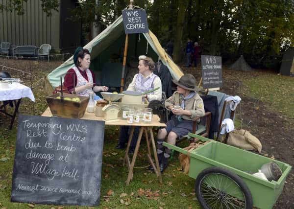 WARTIME SOLACE -- a WRVS rest centre, re-enacted by Carol Deane and Paula Westerside-Downes and her 12-year-old son, Finley. (PHOTO BY: Sarah Washbourn)