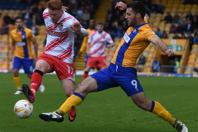 Mansfield's Pat Hoban tackles Stevenage's Dale Gorman