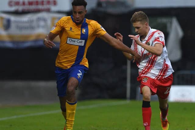 Mansfield's Rhys Bennett battles with Stevenage's Henry Cowans