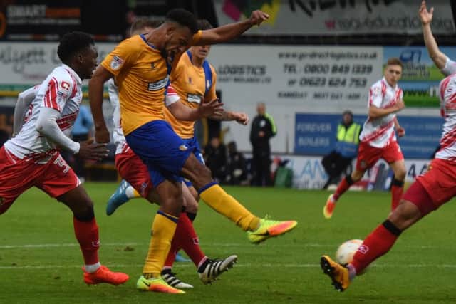 Mansfield's Rhys Bennett has a strike on goal