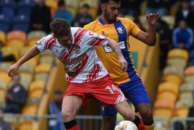 Mansfield's Malvind Benning battles with Stevenage's Ben Kennedy
