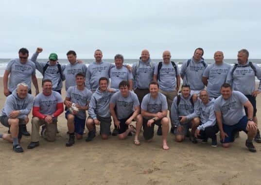 WALKING THE WALK -- sponsored walkers from Sutton and Mansfield who raised £21,000 for charity in a coast-to-coast trek that took in Hadrian's Wall.