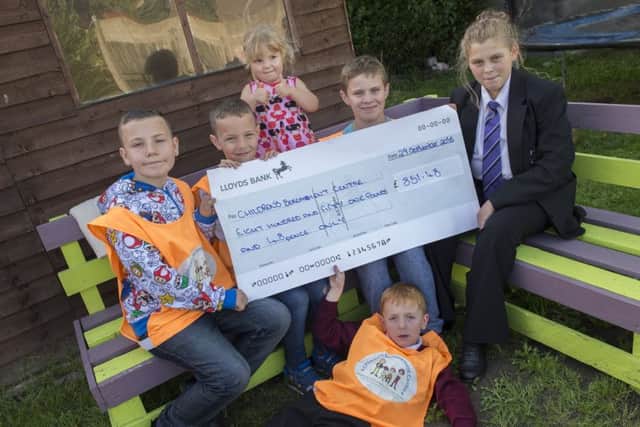 FAMILY FUNDRAISERS -- from left, the six youngsters, Kenny, Alex, Daisy, Logan and Demi, plus Bradley (front). (PHOTO BY: Sarah Washbourn)