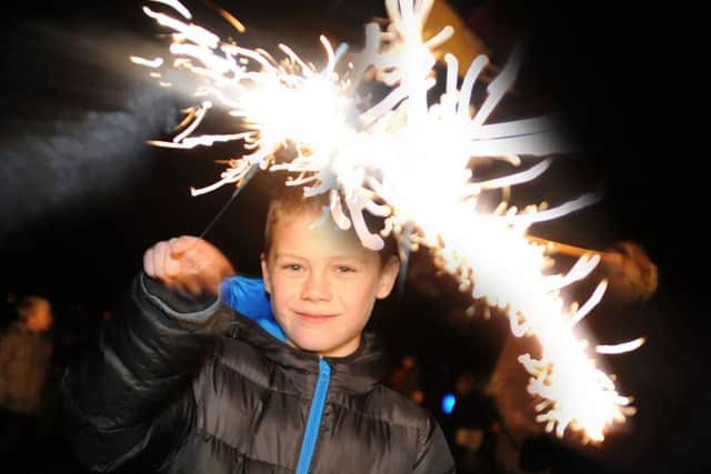 Mansfield Woodhouse firework event.
Ashton Buttery, 8, sparks up at the Debdale Lane Sports Ground firework event on Saturday.