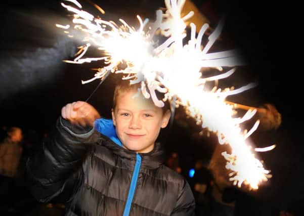Mansfield Woodhouse firework event.  
Ashton Buttery, 8, sparks up at the Debdale Lane Sports Ground firework event on Saturday.
